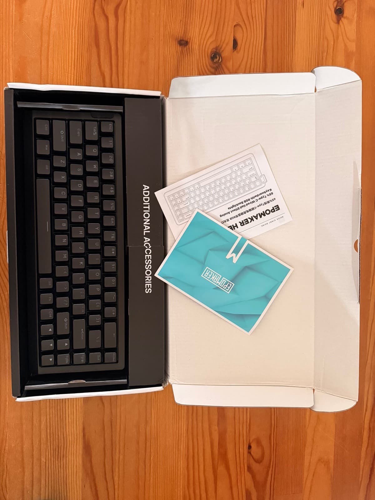 Epomaker HE68 Lite unboxing showing keyboard in inner tray with included accessories card and quick start manual