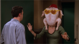 Monica puts turkey on her head